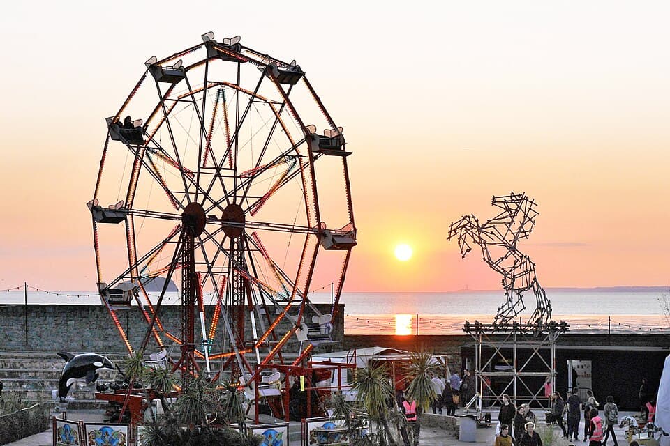 Dismaland Big Wheel Banksy Killer Whale Ben Long Horse Scaffolding Sculpture and sunset