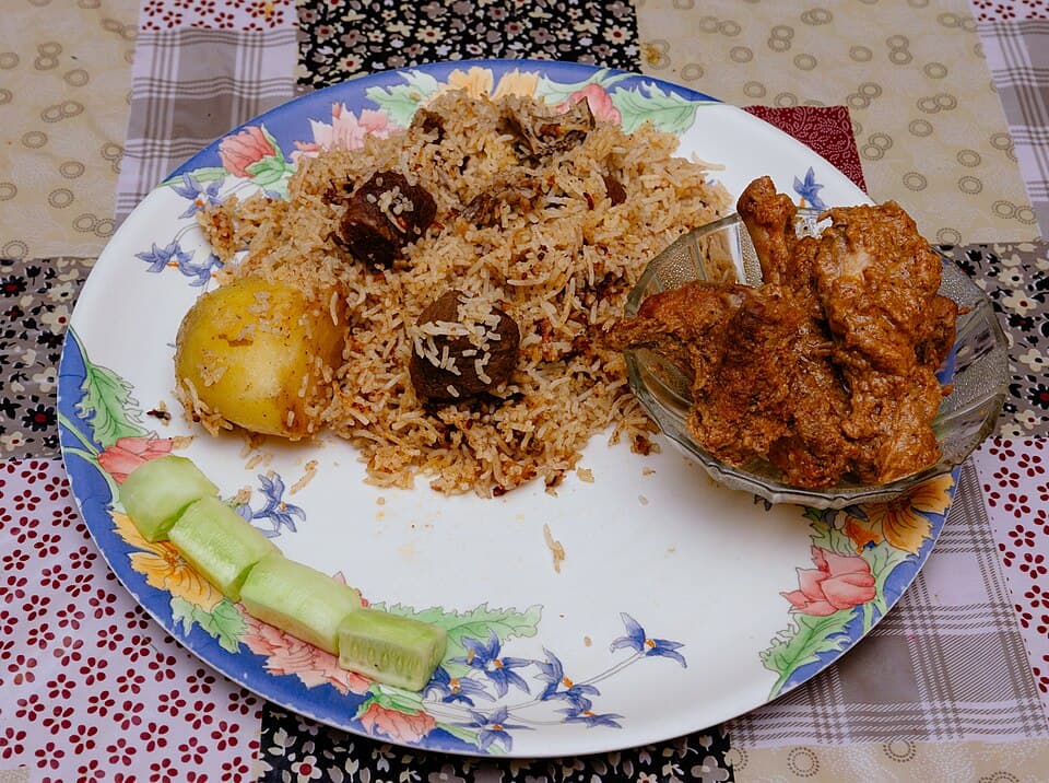 A home made plate of mutton biryani served with chicken kassa cooked in the bengali style