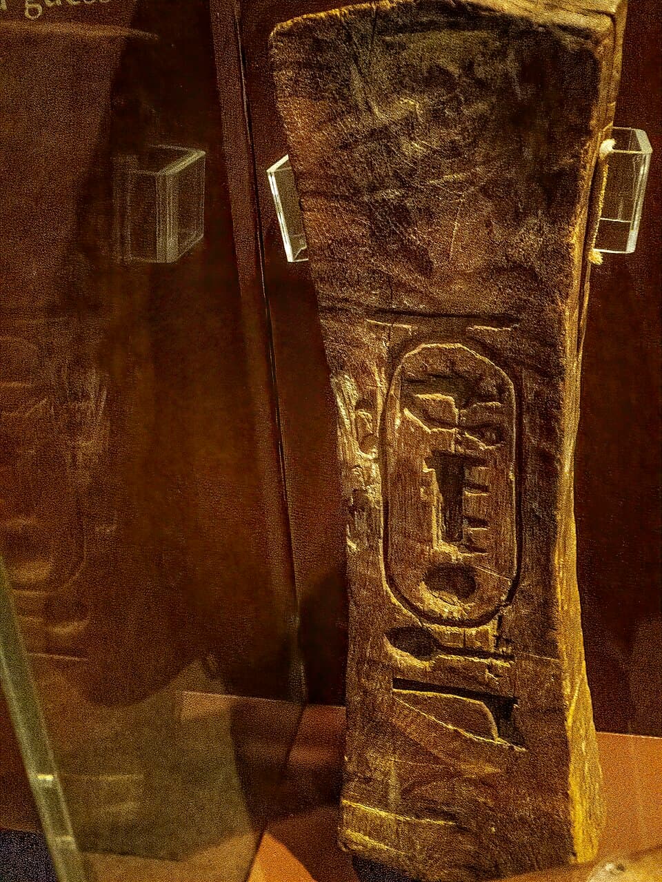 Stone mason's clamp bearing the cartouche of Seti I, wood, 19th Dynasty 1280 BCE Penn Museum
