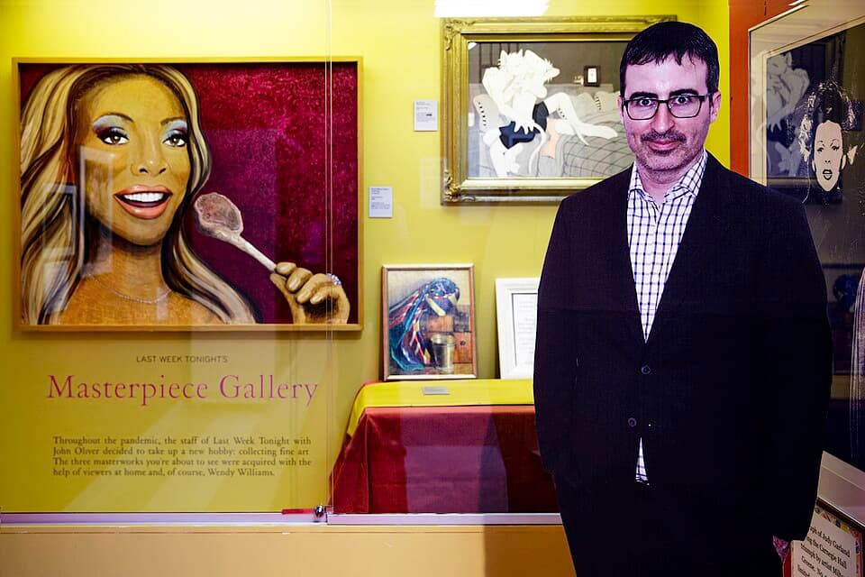 John Oliver (cutout) and paintings in Last Week Tonight's Masterpiece Gallery at the Judy Garland Museum