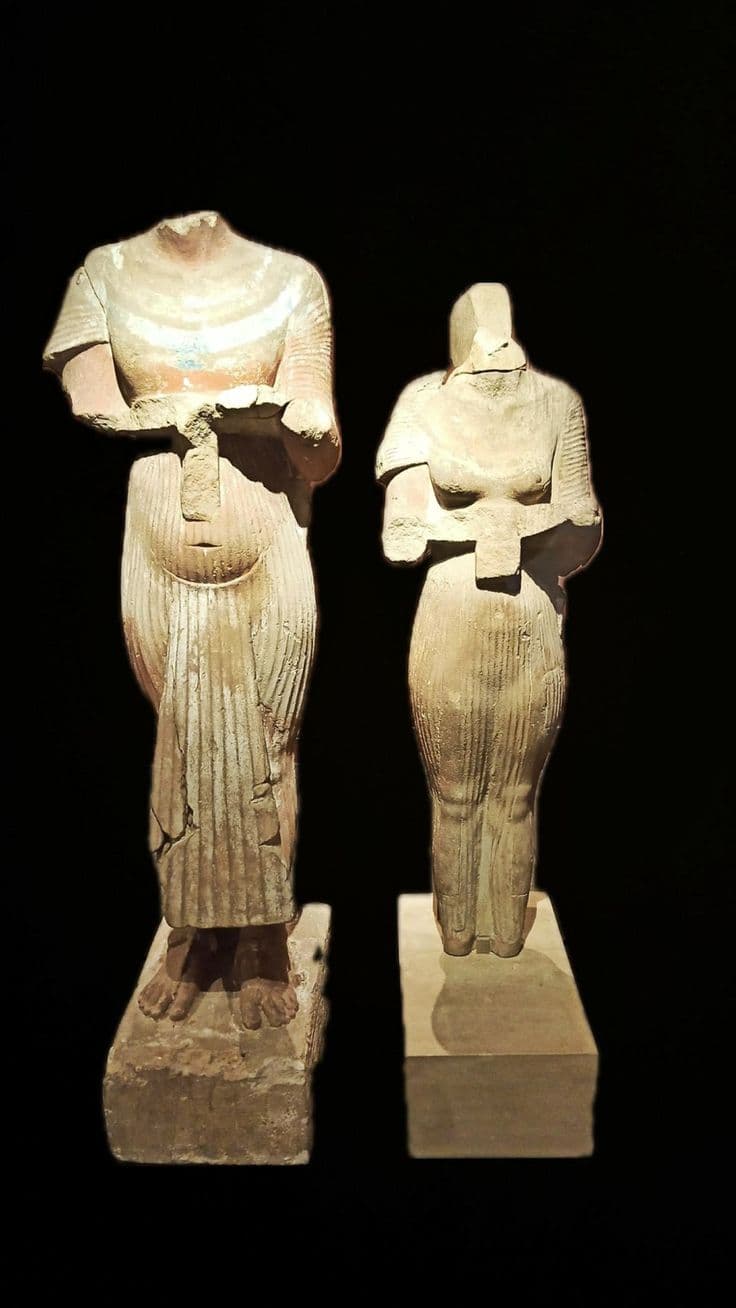 Paired sandstone statues of Akhenaten and Nefertiti